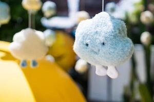 Baby Mobile with Smiling Clouds at Nonthaburii, Thailand. photo