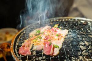 Aromatic Grilling.Succulent Meat with Smoke photo