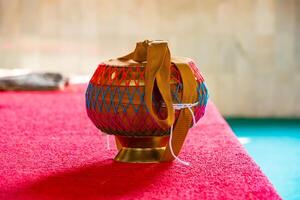 Monk's Alms Bowl Resting on the Floor of a Tranquil Buddhist Temple, Symbolizing Simplicity and Spirituality in a Sacred Space photo