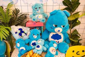 Blue Teddy Bear Collection Arranged in a Playful Indoor Setting with Toys at Nonthaburii, Thailand. photo