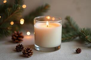 Cozy winter candle with pine cones and twinkling lights - holiday decor for warm ambience photo