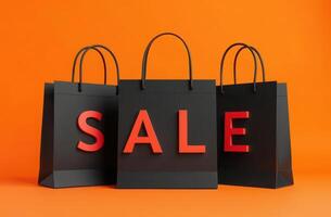 Black shopping bags with red sale letters on vibrant orange background photo