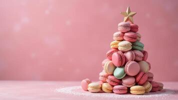 Colorful french macarons tower shaped like a christmas tree with a star topper against a soft pink background photo