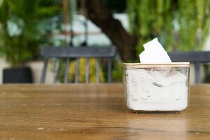 Tissue paper box on wood table. photo