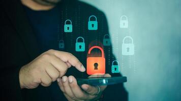 Men use smartphone to access data and unlock digital padlock. photo