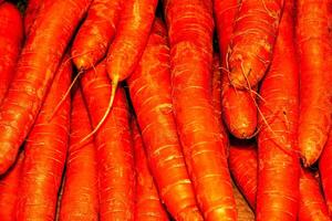 Fresh carrot on the background. The concept of proper nutrition. photo