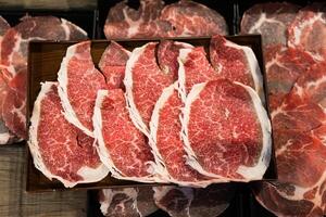 Sliced beef with fatty. Quality beef on tray for hotpot. photo