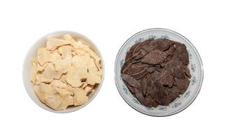 Containers with cocoa butter and grated cocoa, top view, texture. Basic ingredients for making chocolate at home. Close-up of chopped food, top view. photo