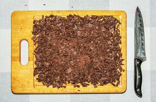 Grated cocoa background, top view, texture. Grated cocoa is one of the ingredients in making chocolate at home. Close-up of crushed cocoa, top view. photo