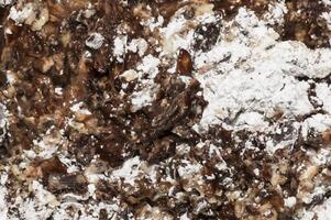 Cocoa butter and cocoa liquor melt, top view, texture. Basic ingredients for making chocolate at home. Close-up of chopped food, top view. photo