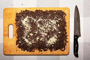 Cocoa butter and cocoa mass, top view, texture. Basic ingredients for making chocolate at home. Close-up of chopped food, top view. photo