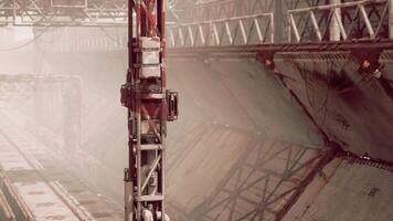 Old destroyed oil terminal with rusting infrastructure in a foggy setting video