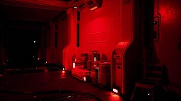 Interior view of a space station in deep red lighting during a routine check video