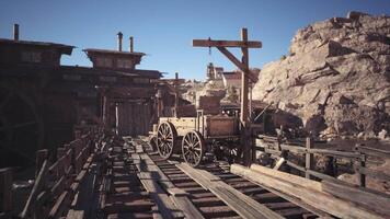A wooden wagon on a rustic dock in a historical mining town video