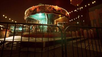 Nighttime amusement park with an illuminated carousel and emptiness video