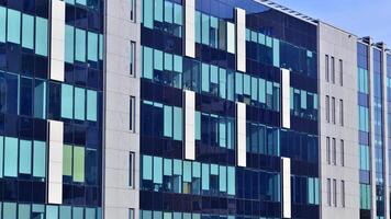 Abstract modern business architecture. Office building with aluminum composite panels. Facade wall made of glass and metal. photo