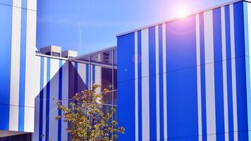 Abstract modern business architecture. Office building with aluminum composite panels. Facade wall made of glass and metal. photo