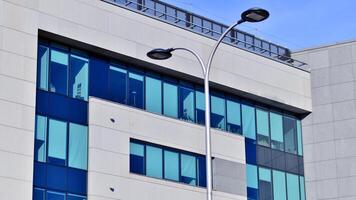 Abstract modern business architecture. Office building with aluminum composite panels. Facade wall made of glass and metal. photo