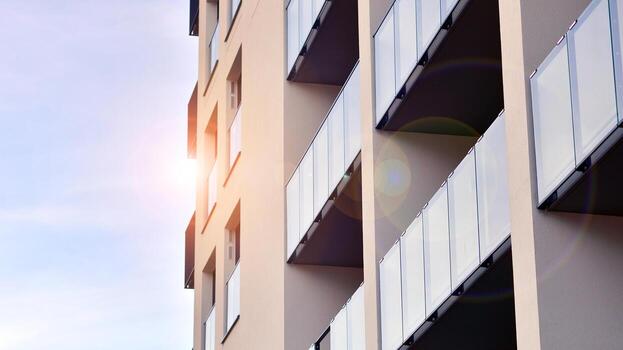 moderno Alto Departamento edificio en blanco, estar alto en contra un azul cielo, ejemplificando innovador urbano arquitectura con pulcro, angular diseños foto