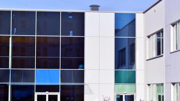 Abstract modern business architecture. Office building with aluminum composite panels. Facade wall made of glass and metal. photo