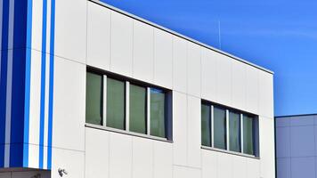 Abstract modern business architecture. Office building with aluminum composite panels. Facade wall made of glass and metal. photo