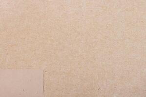 Light brown pulp paper texture with visible fibers and natural rough surface. photo