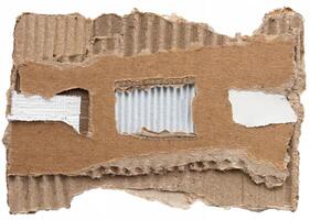 Close-up of torn corrugated cardboard with rough edges and visible texture, ideal for backgrounds and craft designs. photo
