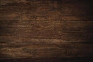 Close-up of a dark rustic wooden plank surface with natural textures and wood grain patterns. photo
