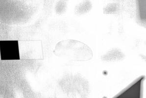 An abstract texture with an overexposed appearance, showing faint shadows in soft, indistinct forms. photo