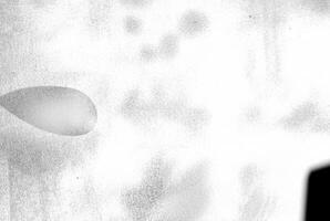 An abstract texture with an overexposed appearance, showing faint shadows in soft, indistinct forms. photo