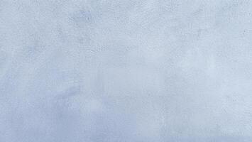 Blue plaster wall texture with a smooth surface, perfect for backgrounds or design projects. photo