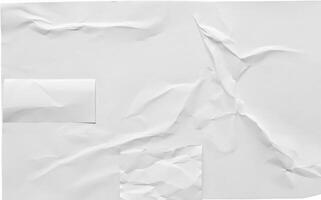 Crumpled white sheet of paper with folds and creases, isolated on a white background, ideal for design or texture use. photo