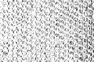 High-contrast black and white bubble wrap texture, featuring circular patterns and crinkled details. photo