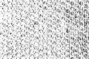 High-contrast black and white bubble wrap texture, featuring circular patterns and crinkled details. photo