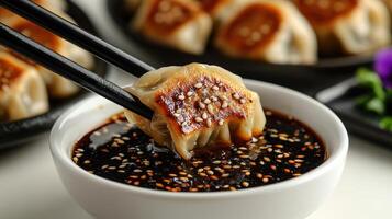 Savoring a perfectly fried dumpling in rich soy sauce as twilight sets in photo