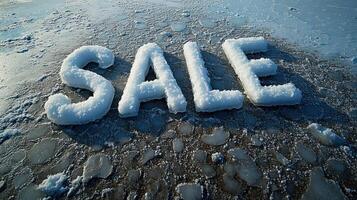 Snow forms the word sale on a frozen surface, capturing winter's playful spirit photo