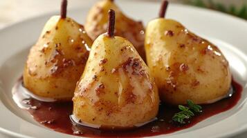 Tender poached pears coated in sweet sauce offer a delightful dessert experience photo