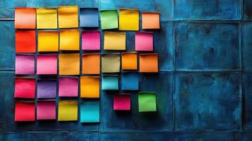 Brightly colored sticky notes create an engaging display against a blue background photo