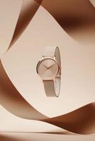 This exquisite gold watch features a captivating white dial and matching strap, showcased against a soft beige background with decorative ribbons, making it ideal for branding or marketing photo