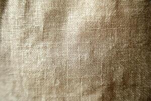 A closeup, detailed view of an exquisite, soft, natural linen fabric that highlights its unique texture and weave photo