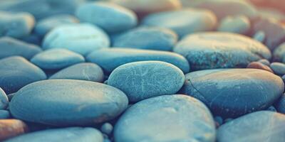 The serene image displays smooth pebbles under soft light, creating a calming atmosphere of tranquility and peace photo