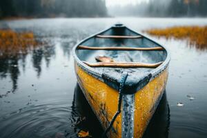 A serene image of a yellow canoe on a misty autumn lake exudes tranquility, creating a calming atmosphere photo