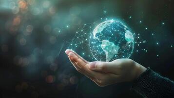 A hand grips a digital Earth globe connected to a network, symbolizing global technology and connectivity photo