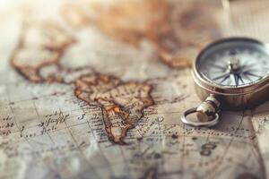 A detailed view of an ancient map showcasing the Americas, complete with a traditional compass positioned on top photo