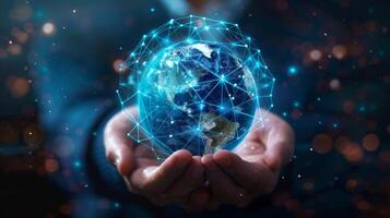 Depiction of human hands holding a digitally connected globe, symbolizing a global network enabled by technology photo