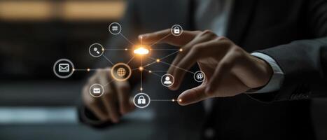 A hand gracefully interacts with a vibrant digital interface that showcases various technology icons, representing online networks, cloud storage solutions, and advanced security systems for users photo