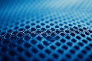 Delve into the fascinating and unique texture of the blue fabric specifically designed for sports jerseys, which includes a breathable mesh pattern essential for highquality athletic wear photo