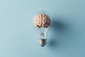 This striking image represents innovation, depicting a vibrant brain within a glowing light bulb, symbolizing creativity, new ideas, and the ongoing inspiration that drives progress in various fields photo
