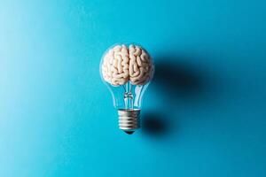 This illustration shows a brain inside a light bulb, symbolizing innovative ideas by merging intelligence and creativity, reflecting the essence of inspiration through its intricate design photo