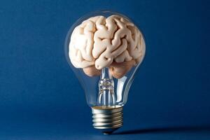A creative concept visualizes a brain inside a glowing light bulb, symbolizing the continuous generation of innovative ideas that illuminate our minds as we explore new possibilities photo